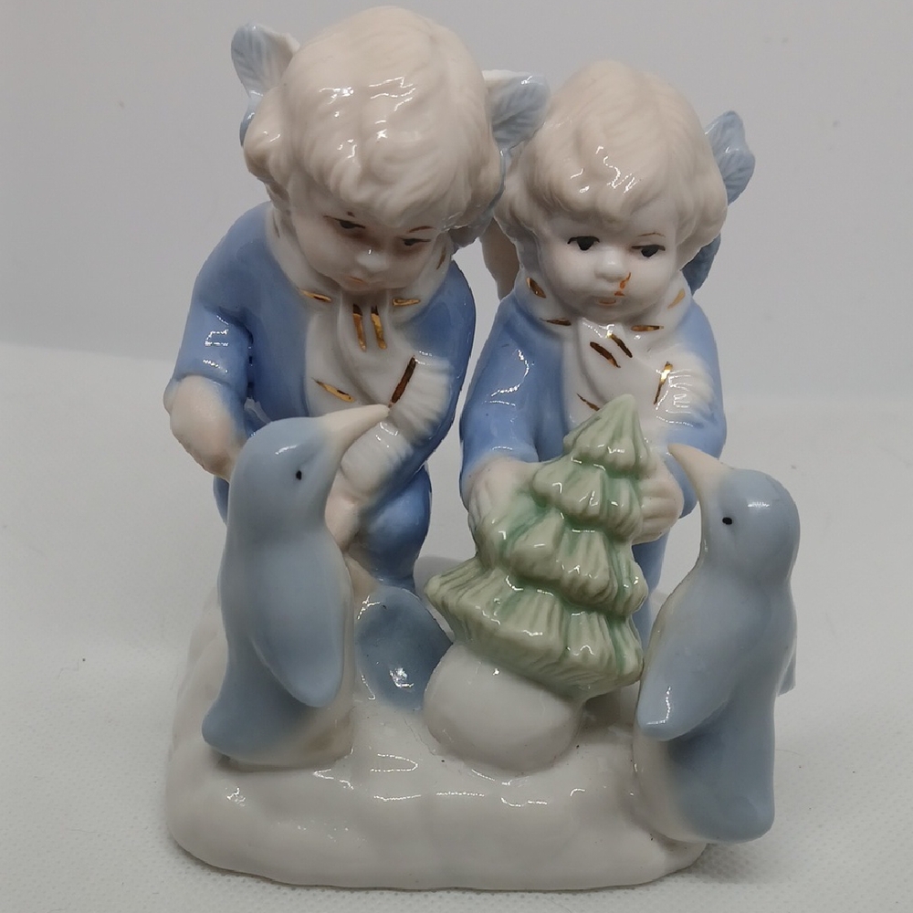 Porcelain Angel Figurine with Penguins